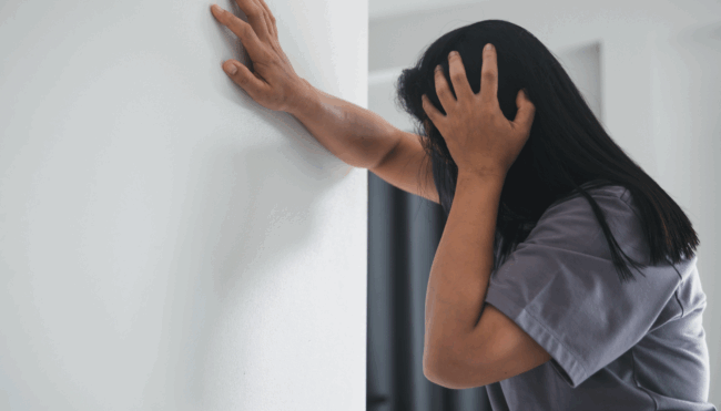 Woman holding her head